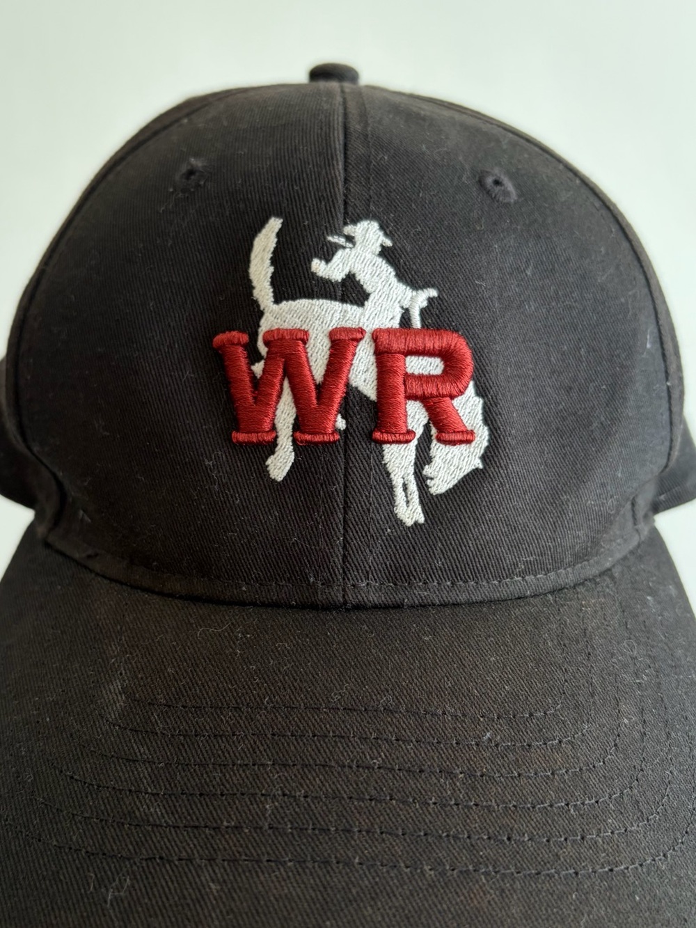 Black Baseball Cap with Red WR Embroidery and White Rodeo Graphic